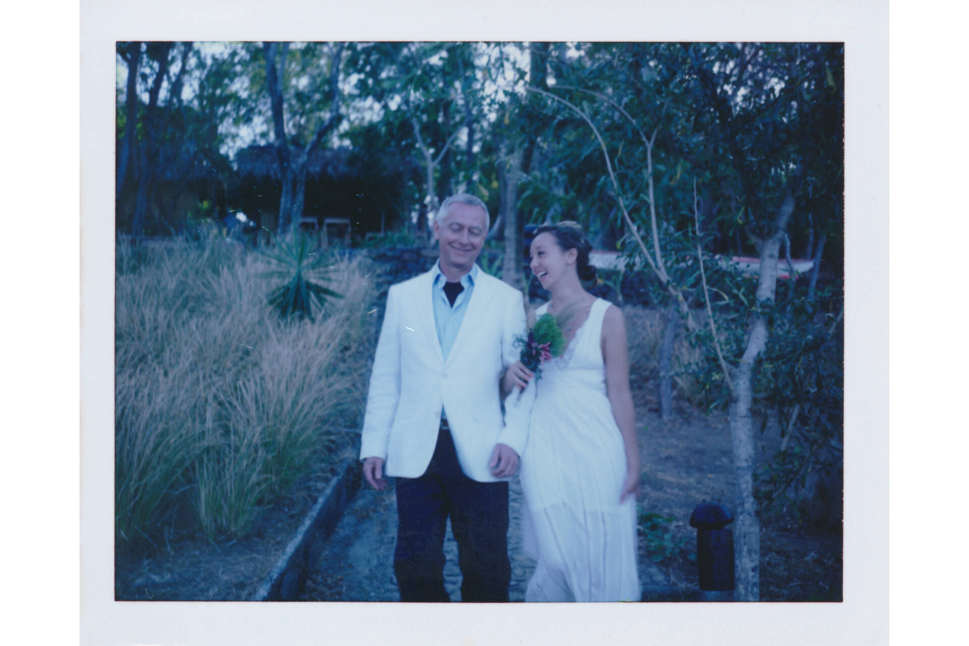 Nicole walking down the aisle with her dad at our wedding, shot on FB-100C film