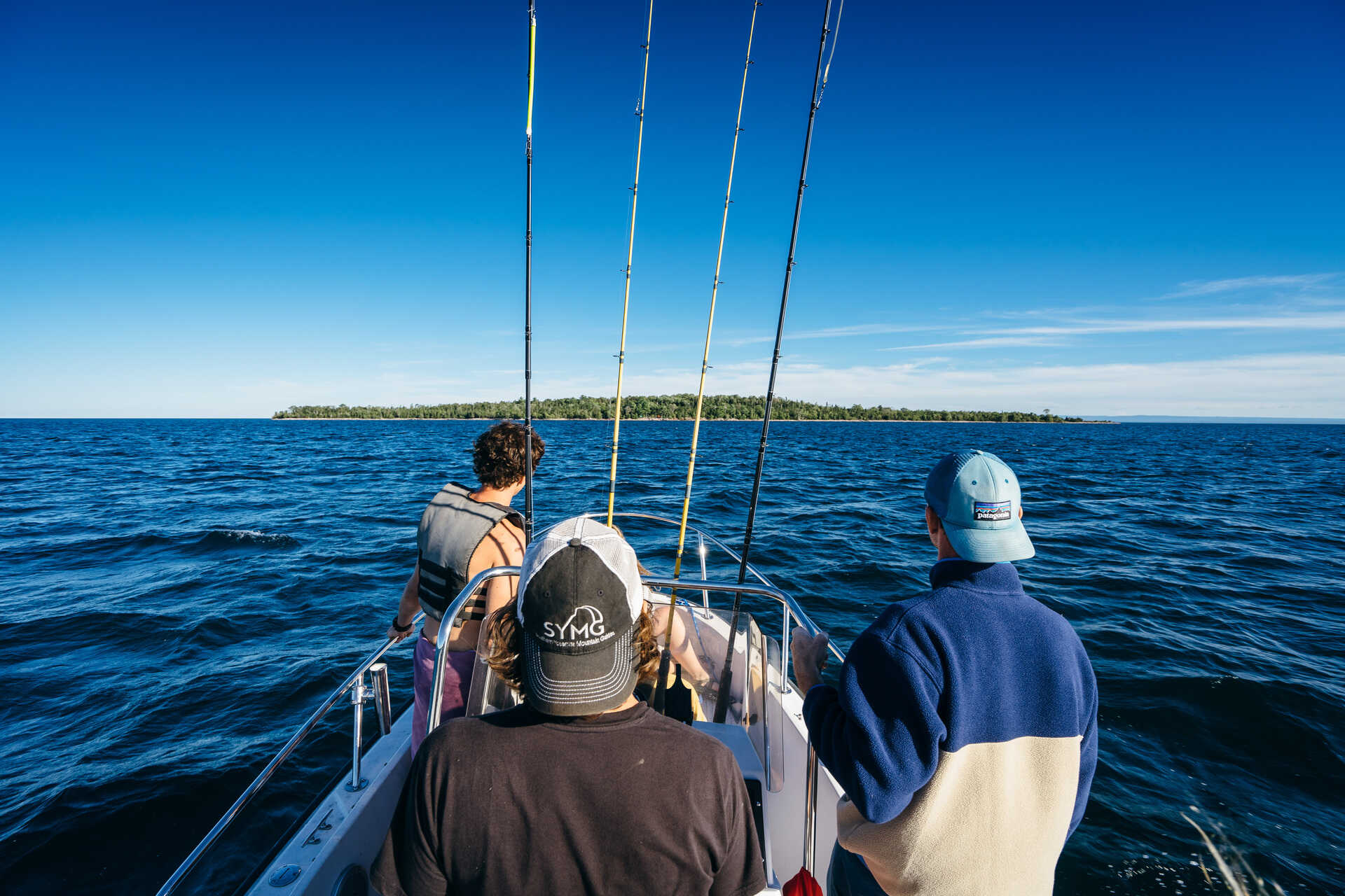Driving a boat to Rabbit Island in Torch Lake Township, Michigan